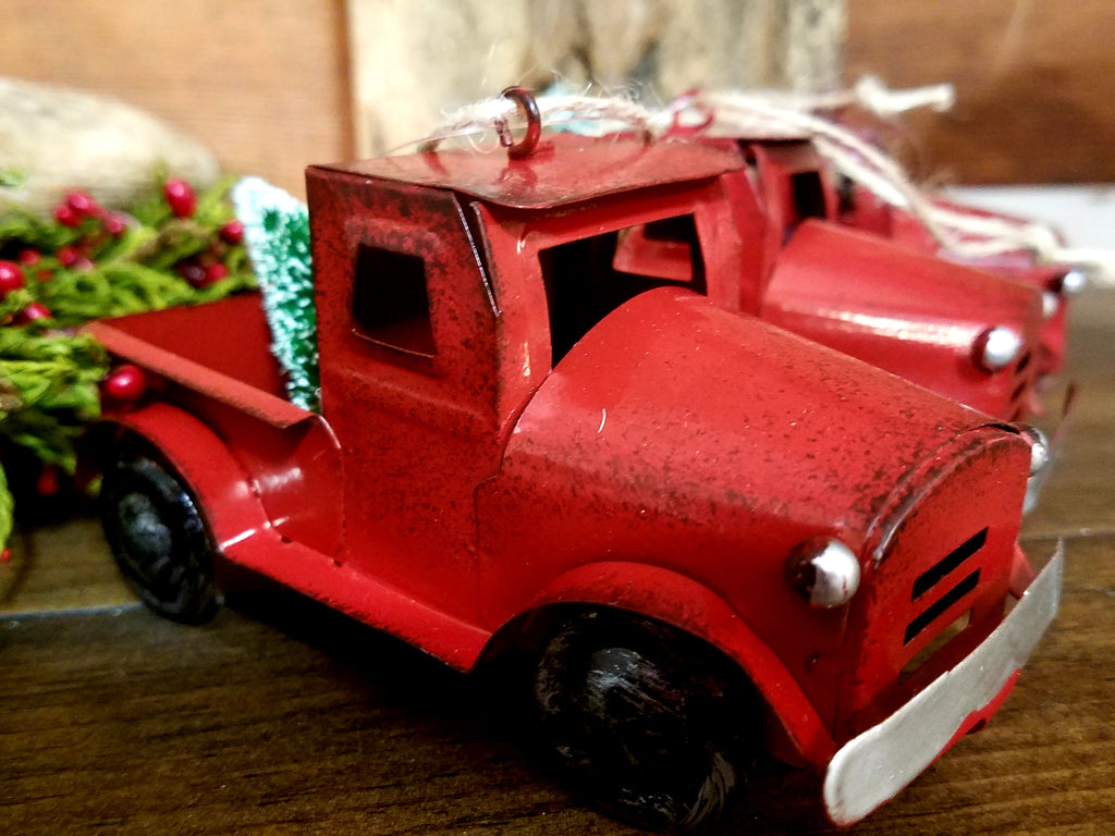 red metal truck ornament with christmas tree