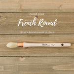 french round paint brush on wood